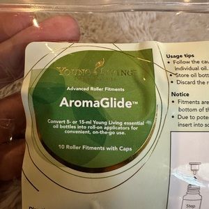 Unused AromaGlide roller fitments with caps.